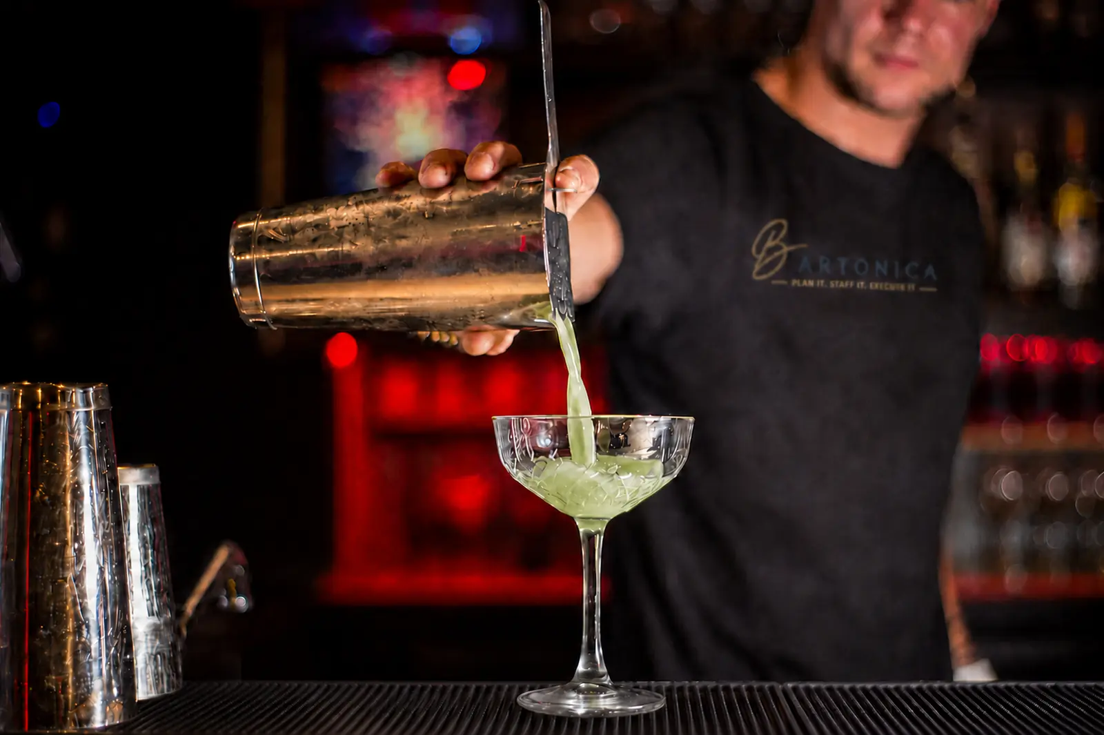 Professional Bartonica bartender preparing a cocktail at an elegant event